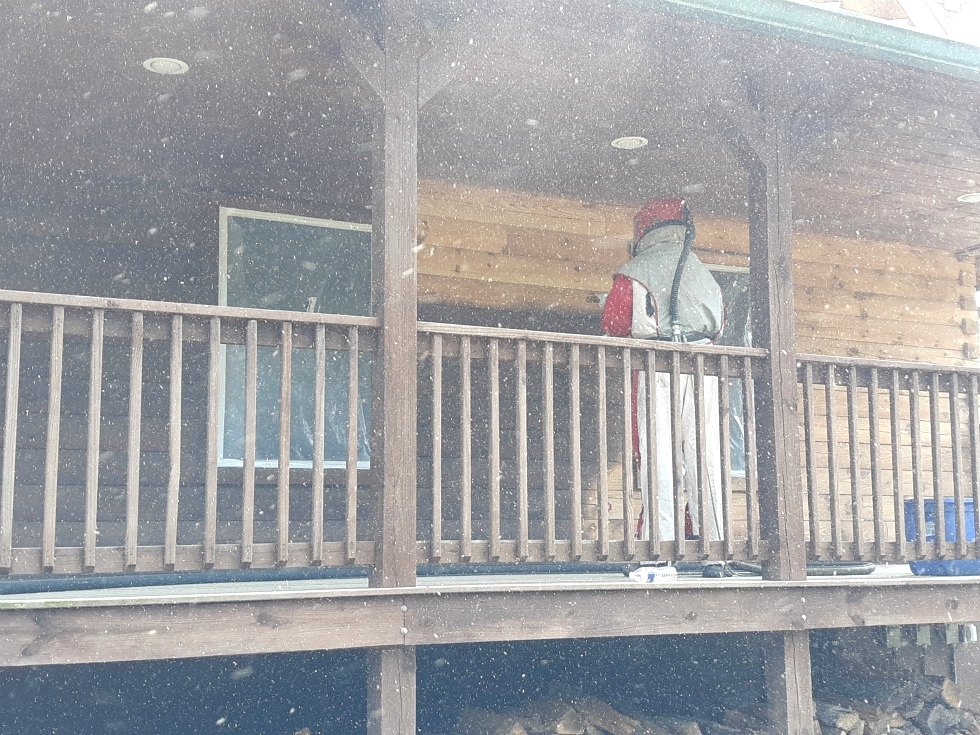 Media blasting log home by the LogDoctors Log Home Repair 